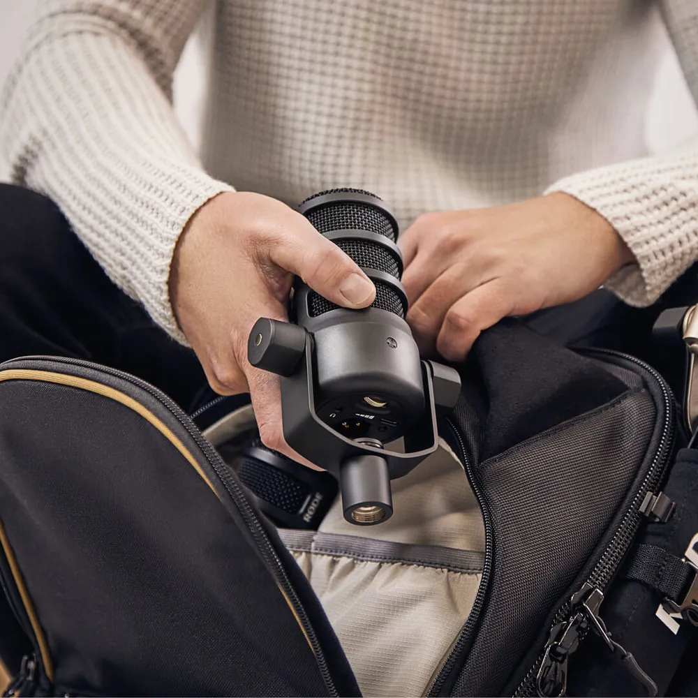 PodMic USB being packed into a backpack